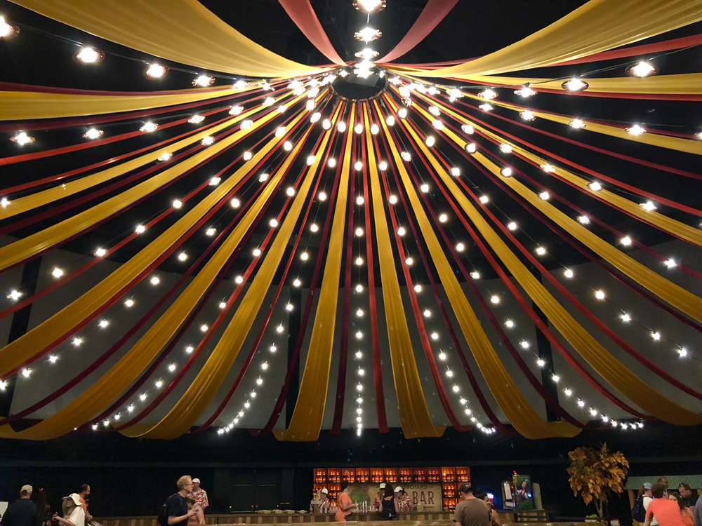 Yellow and red ribbons with lights hanging from the ceiling