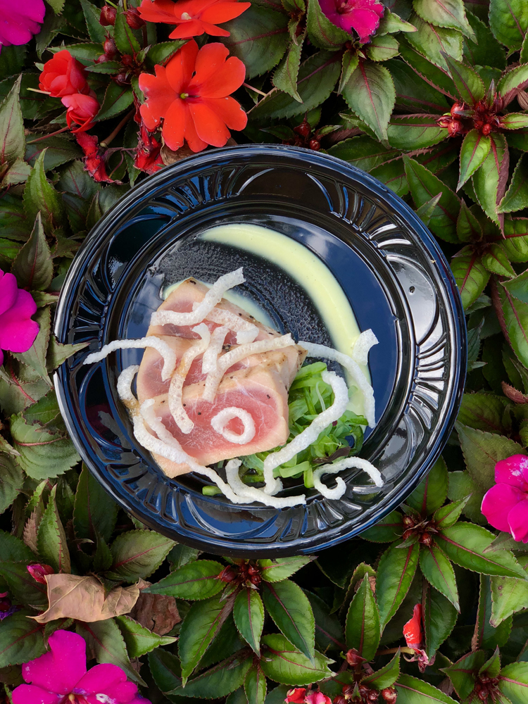 Grilled Tuna Tataki on a black plate