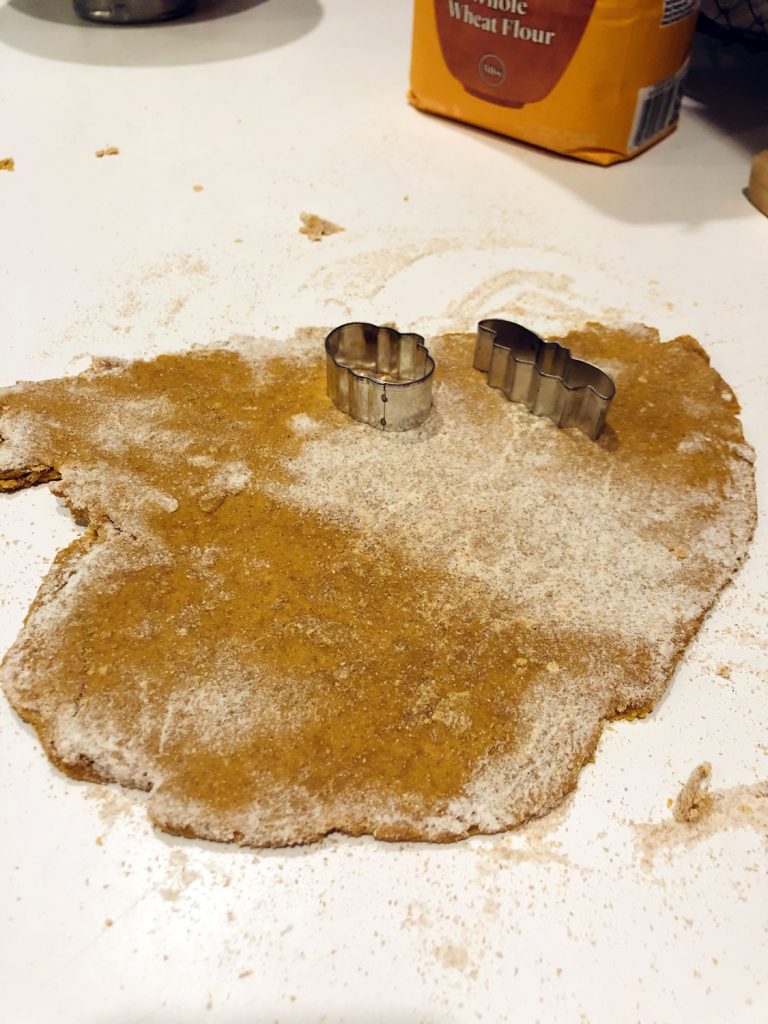 Peanut Butter Pumpkin Dog Treats Dough Rolled out on a white counter top.